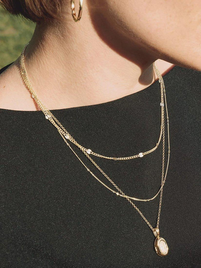 Daisy London gold locket necklace, lab-grown sapphire (British brand)