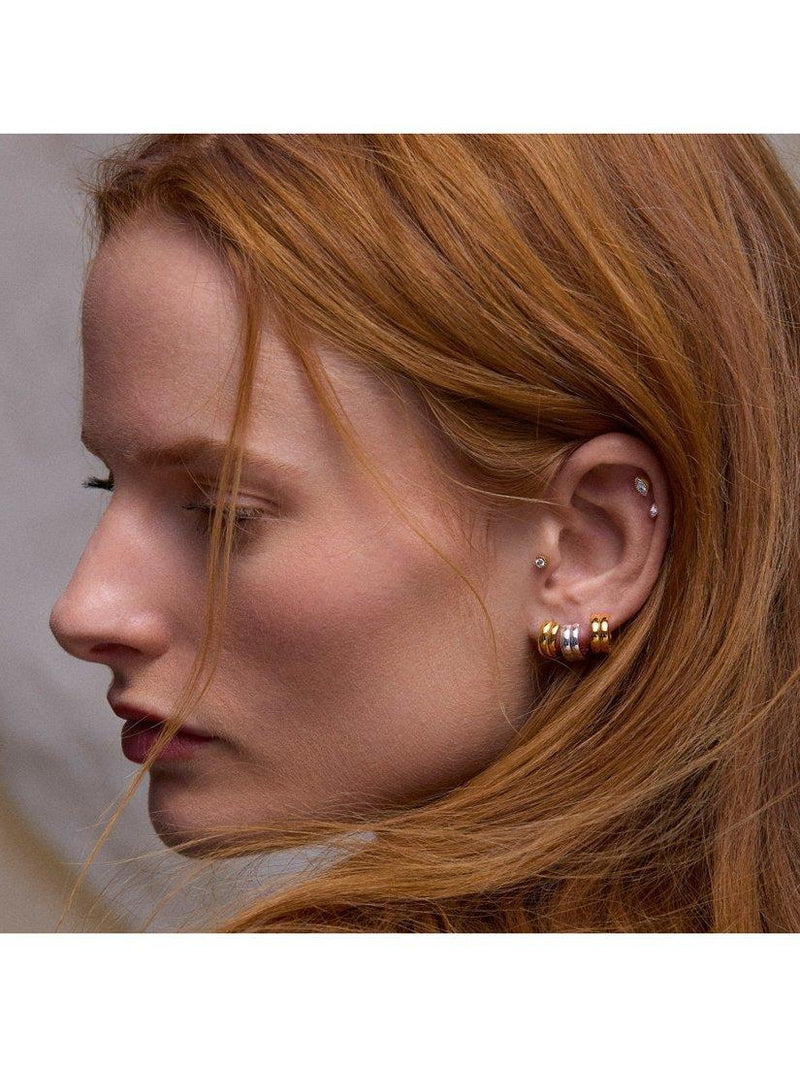 Dinny Hall sterling silver huggie hoop earrings, imported from the UK