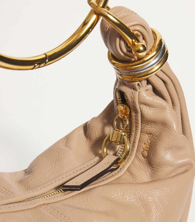Chloé small leather bracelet bag with gold-tone handle (British brand)