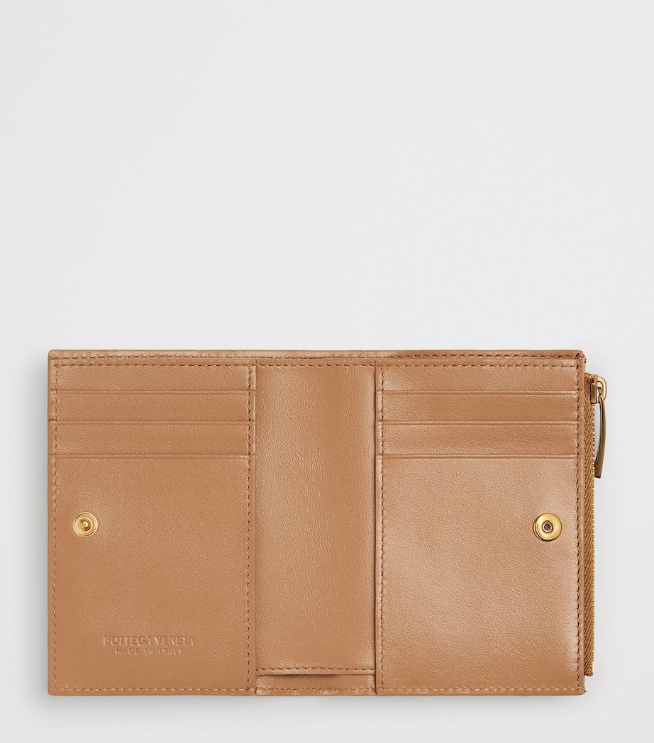 Bottega Veneta small leather Intrecciato bifold wallet, imported from the UK