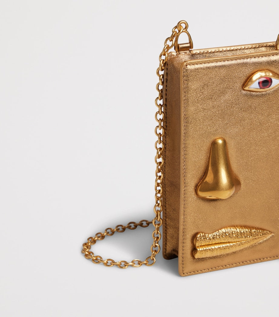 Schiaparelli leather face phone pouch, UK version