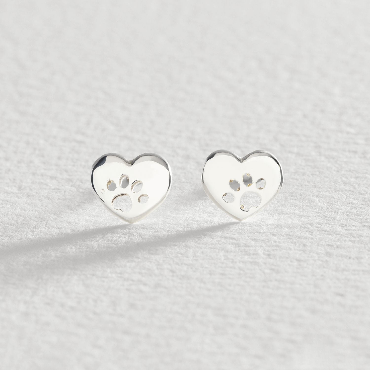 Revere sterling silver heart paw stud earrings, UK version