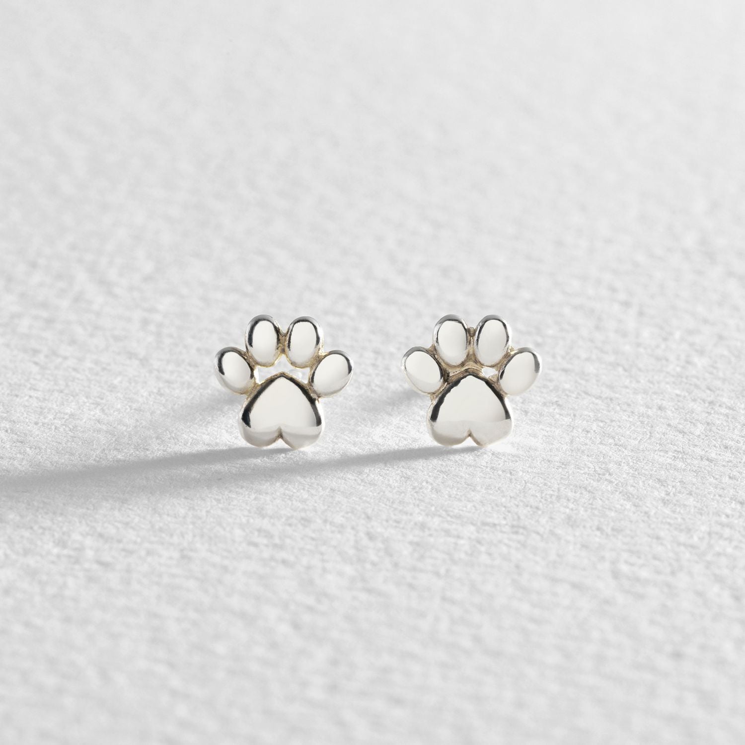 Revere sterling silver paw stud earrings - British product