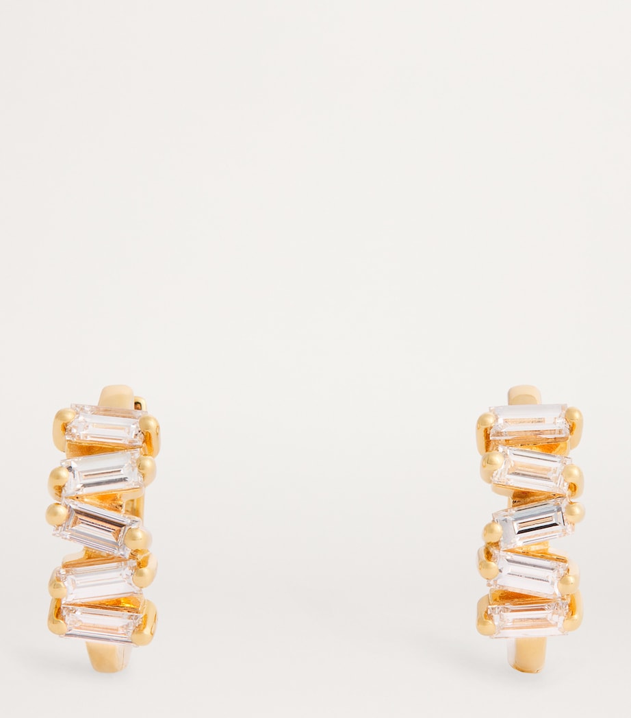 Suzanne Kalan yellow gold huggie earrings with baguette diamonds (British brand)