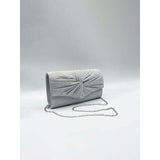 SVNX ruched bow clutch bag in silver (British brand)