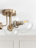 Brass Jackson flush ceiling light with three clear glass shades, UK version