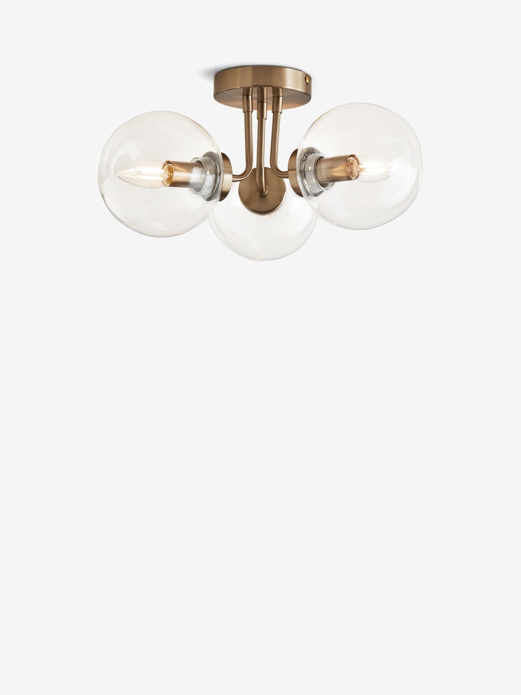 Brass Jackson flush ceiling light with three clear glass shades, UK version