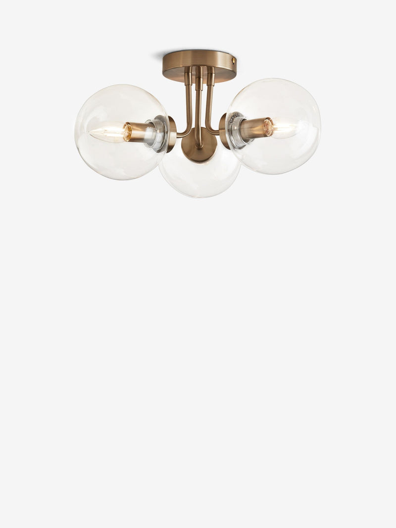 Brass Jackson flush ceiling light with three clear glass shades, UK version