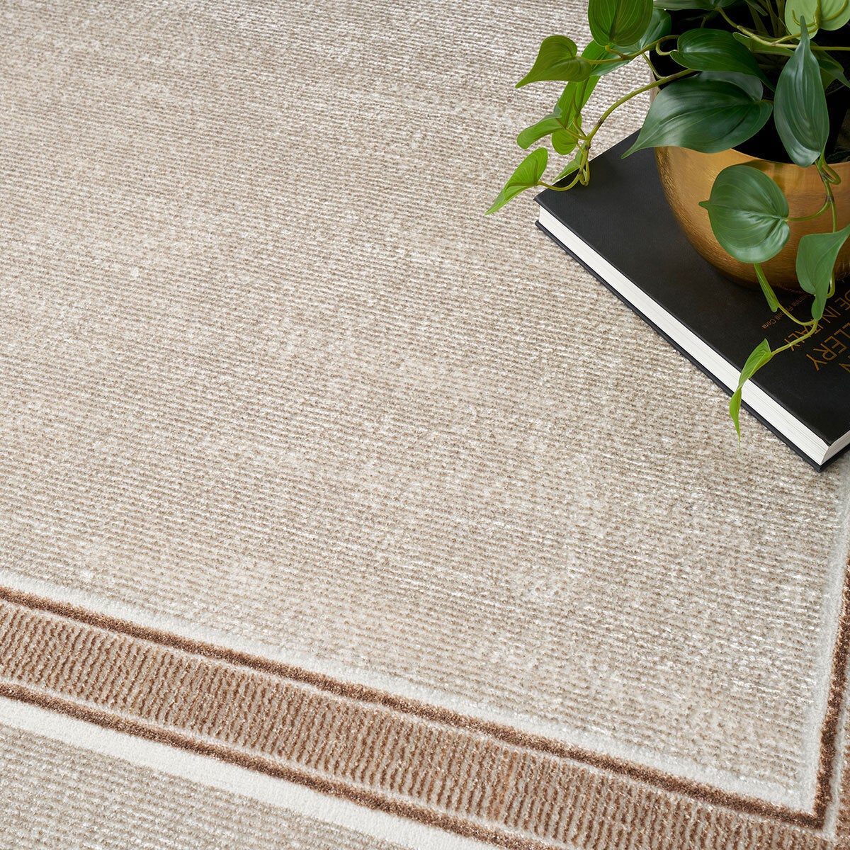 Nourison Glitz Cream Border rug available in three sizes, UK version