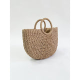 Round woven straw holdall with circular handle (British brand)