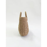 Round woven straw holdall with circular handle (British brand)