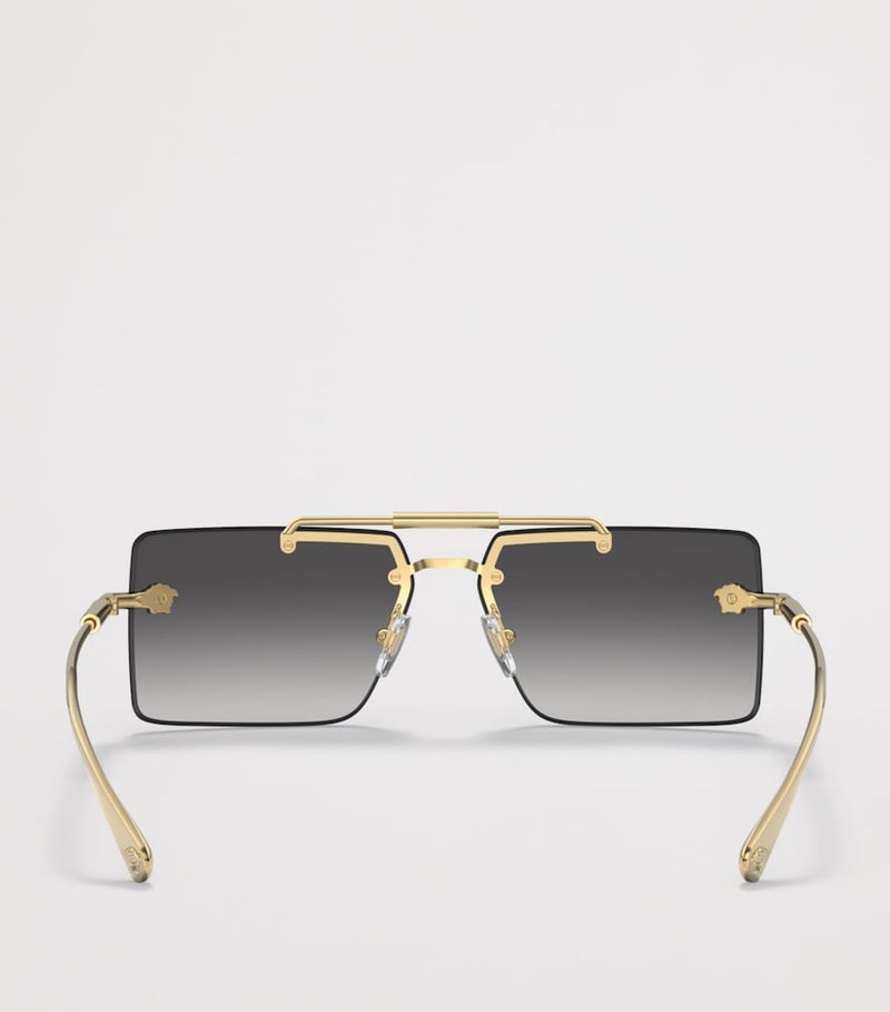 Lunettes de soleil rectangulaires sans monture Versace en métal doré - Produit britannique