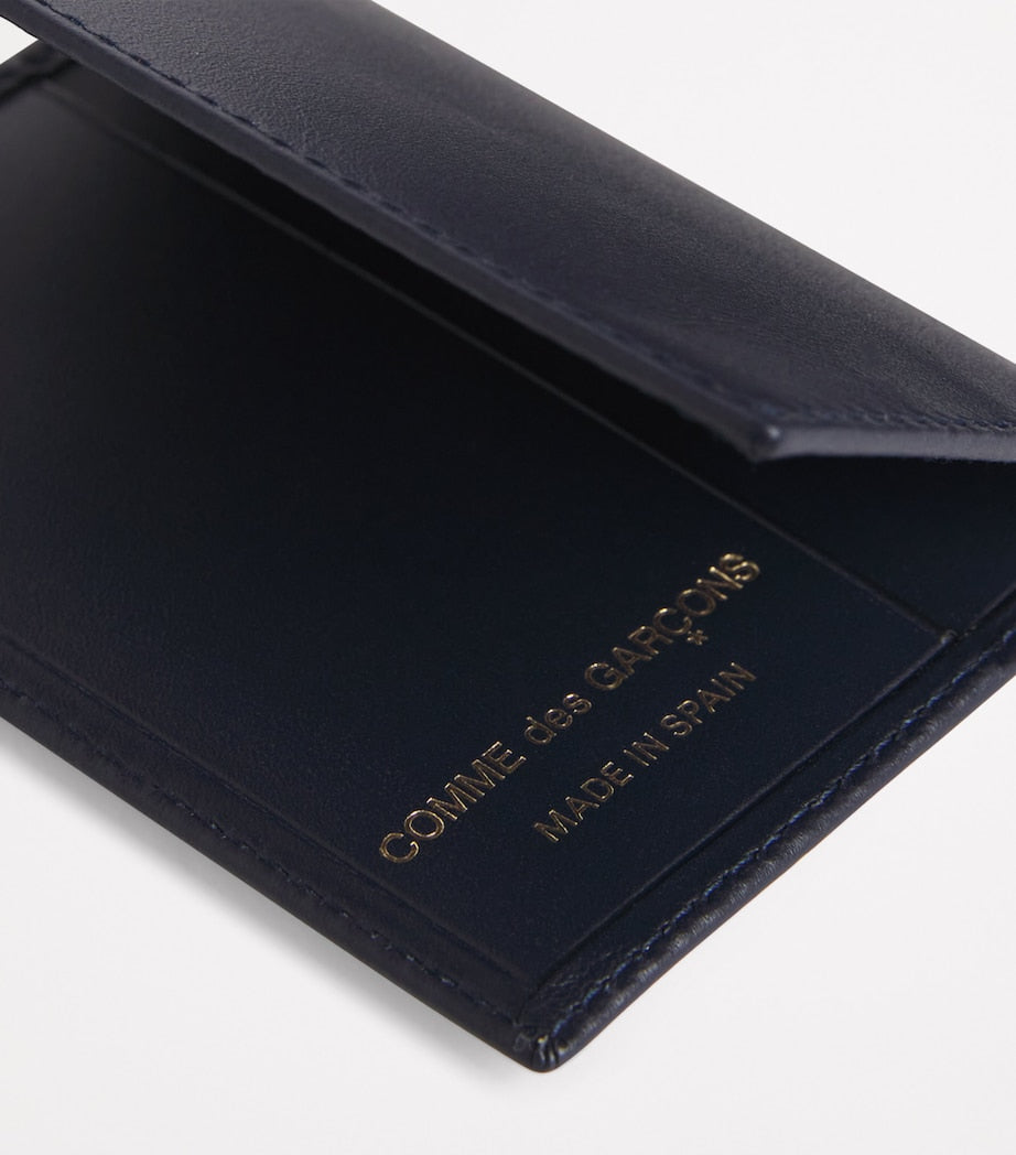 Comme des Garçons leather bifold card holder 10x7cm, imported from the UK
