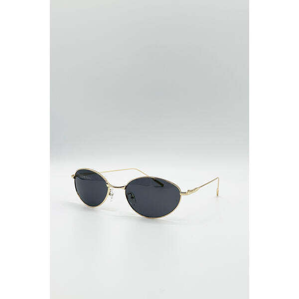 SVNX cat eye sunglasses in black with gold frame, UK version