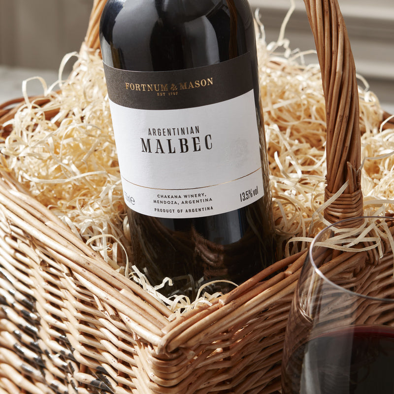 Wicker wine hamper with four assorted bottles, imported from the UK