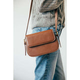 SVNX rounded crossbody bag in brown (British brand)