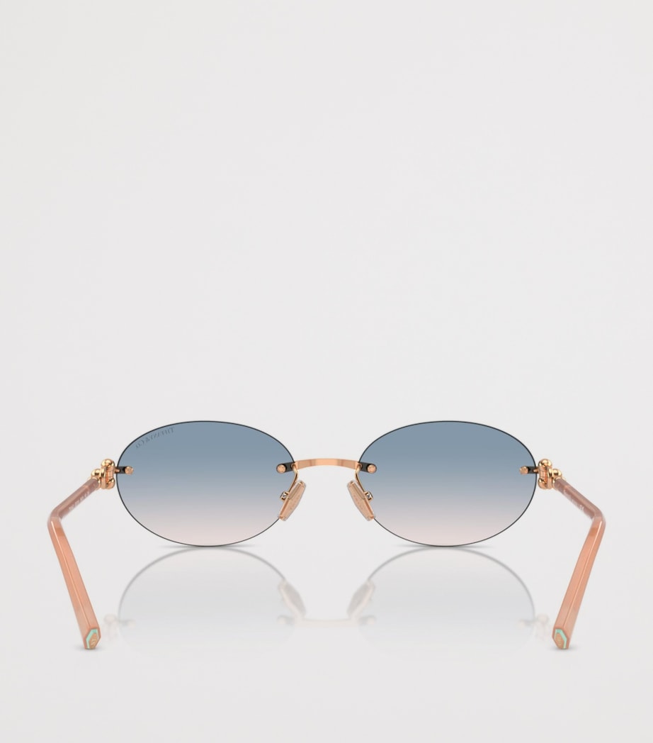 Tiffany & Co. rimless oval sunglasses with gold-tone temples, UK version