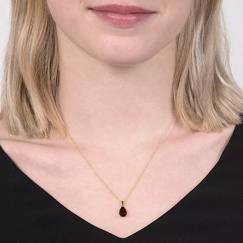 E.W Adams yellow gold garnet pendant necklace, imported from the UK