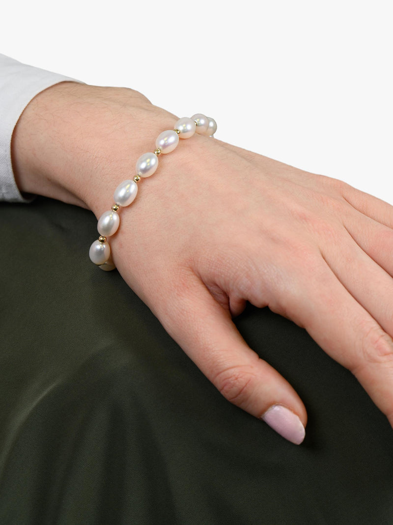 E.W Adams oval freshwater pearl bracelet with 9ct gold, imported from the UK