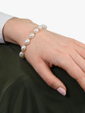 E.W Adams oval freshwater pearl bracelet with 9ct gold, imported from the UK
