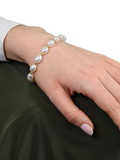 E.W Adams oval freshwater pearl bracelet with 9ct gold, imported from the UK