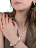 E.W Adams oval freshwater pearl bracelet with 9ct gold, imported from the UK