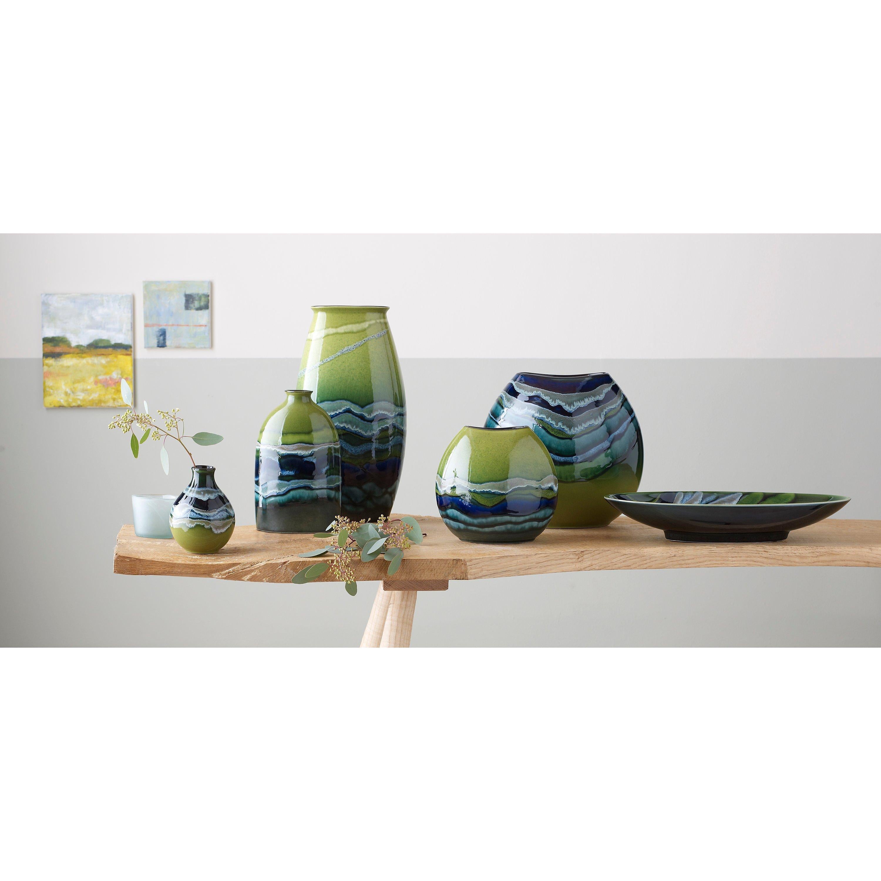 Poole Pottery green hourglass-shaped bud vase with 12cm height, imported from the UK