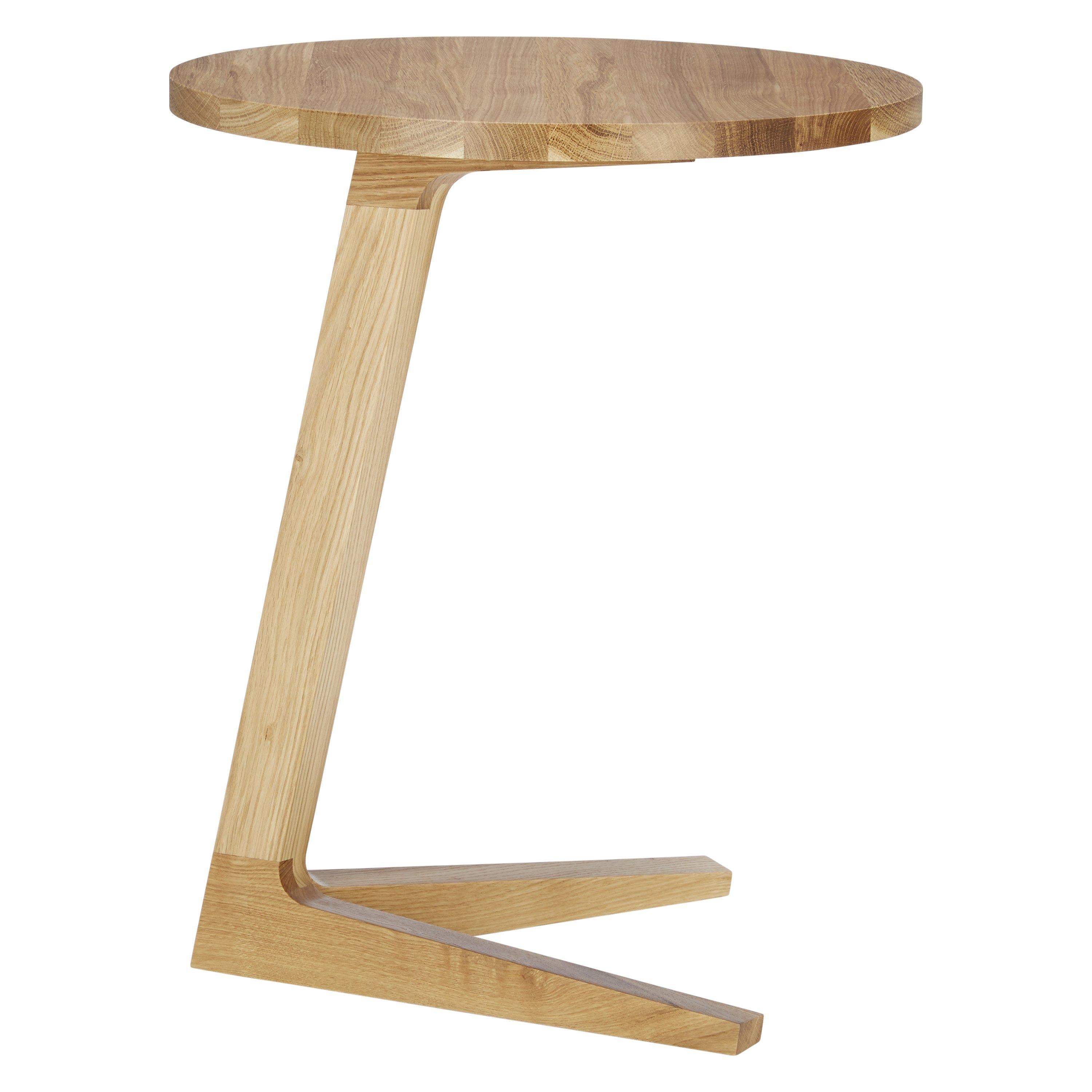 Case Cross round side table in solid oak finish, UK version