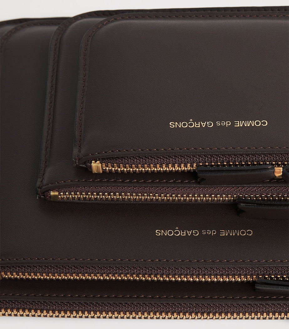 Comme des Garçons medium leather outside pocket wallet, imported from the UK