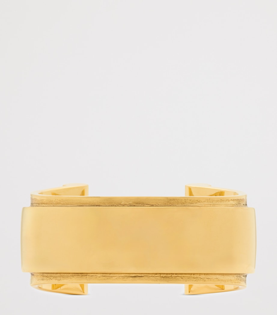 Saint Laurent Scroll Open Cuff Bracelet brass, imported from the UK