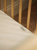 The Little Green Sheep waterproof cotbed mattress protector (British brand)