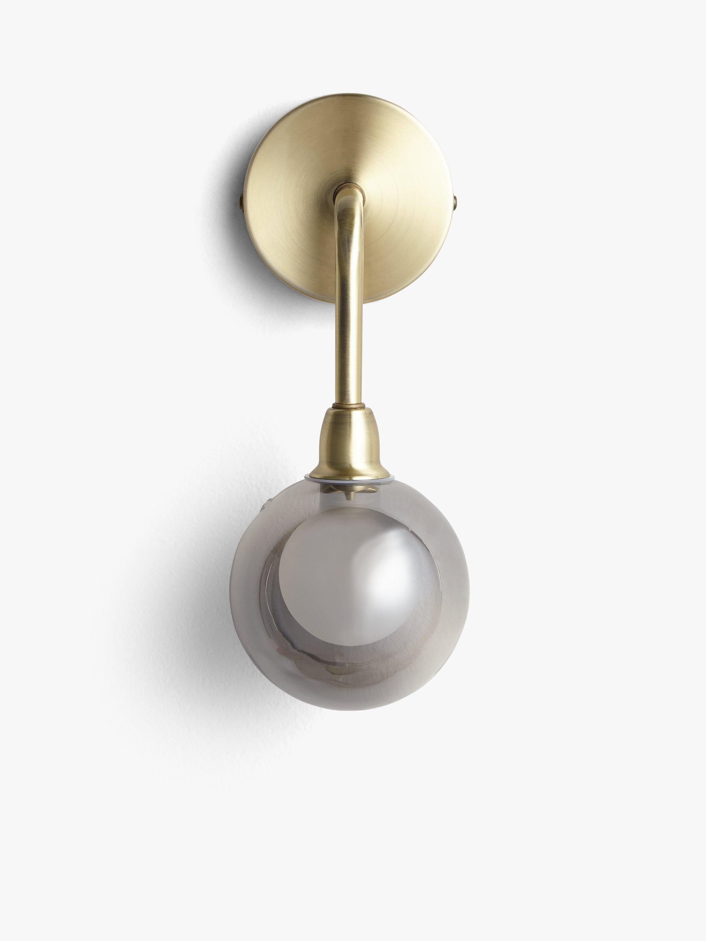 John Lewis Huxley wall light in antique brass with smoked glass shade, UK version