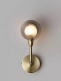 John Lewis Huxley wall light in antique brass with smoked glass shade, UK version