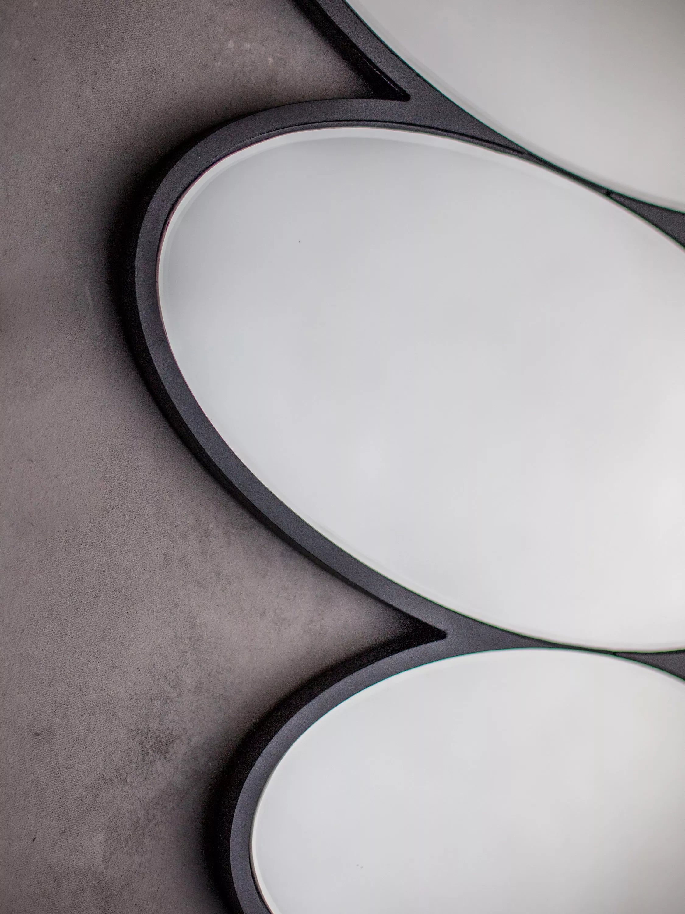 Gallery Direct Pebble Stack abstract wall mirror 118x54cm black (British brand)