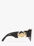 Versace women's irregular sunglasses in black/grey polyamide, imported from the UK