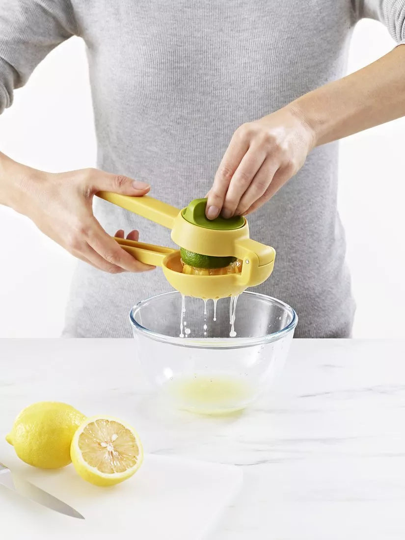 Joseph Joseph citrus press in bright yellow for juicing lemons and limes, UK version
