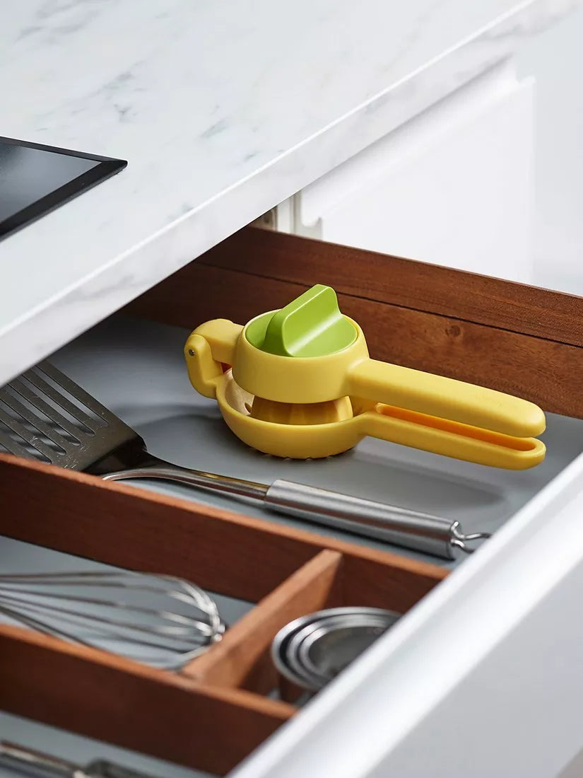 Joseph Joseph citrus press in bright yellow for juicing lemons and limes, UK version