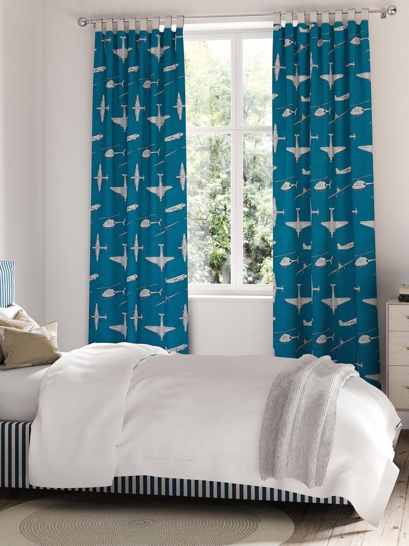 Harlequin Chocks Away fabric with aircraft pattern, imported from the UK