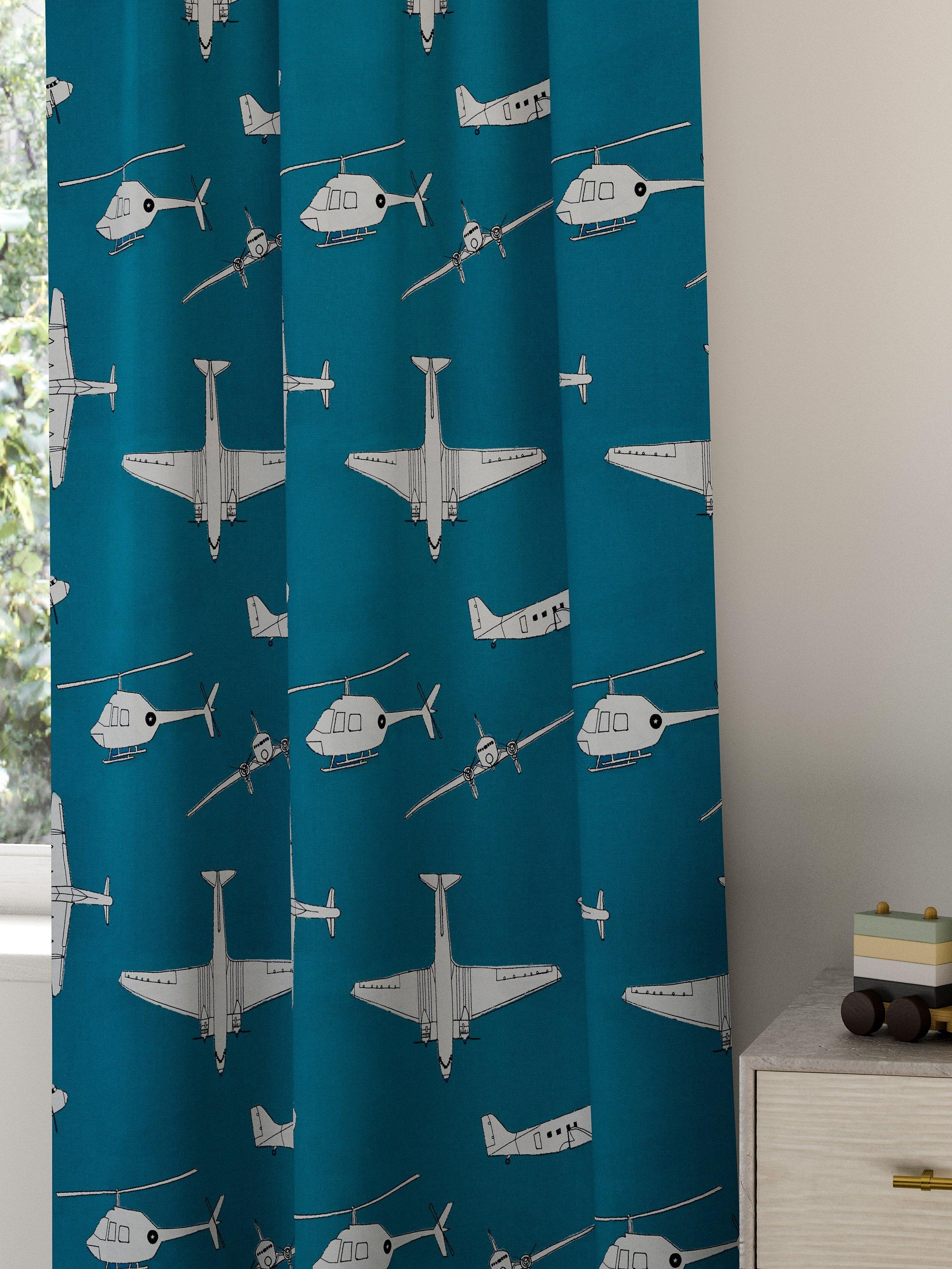 Harlequin Chocks Away fabric with aircraft pattern, imported from the UK