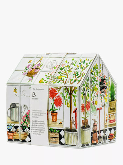 Set de regalo de belleza con temática de invernadero, que incluye productos para el cuidado de manos y cuerpo y semillas de flores silvestres.