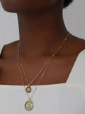 Ralph Lauren layered gold-tone necklace with crest and logo pendant (British brand)