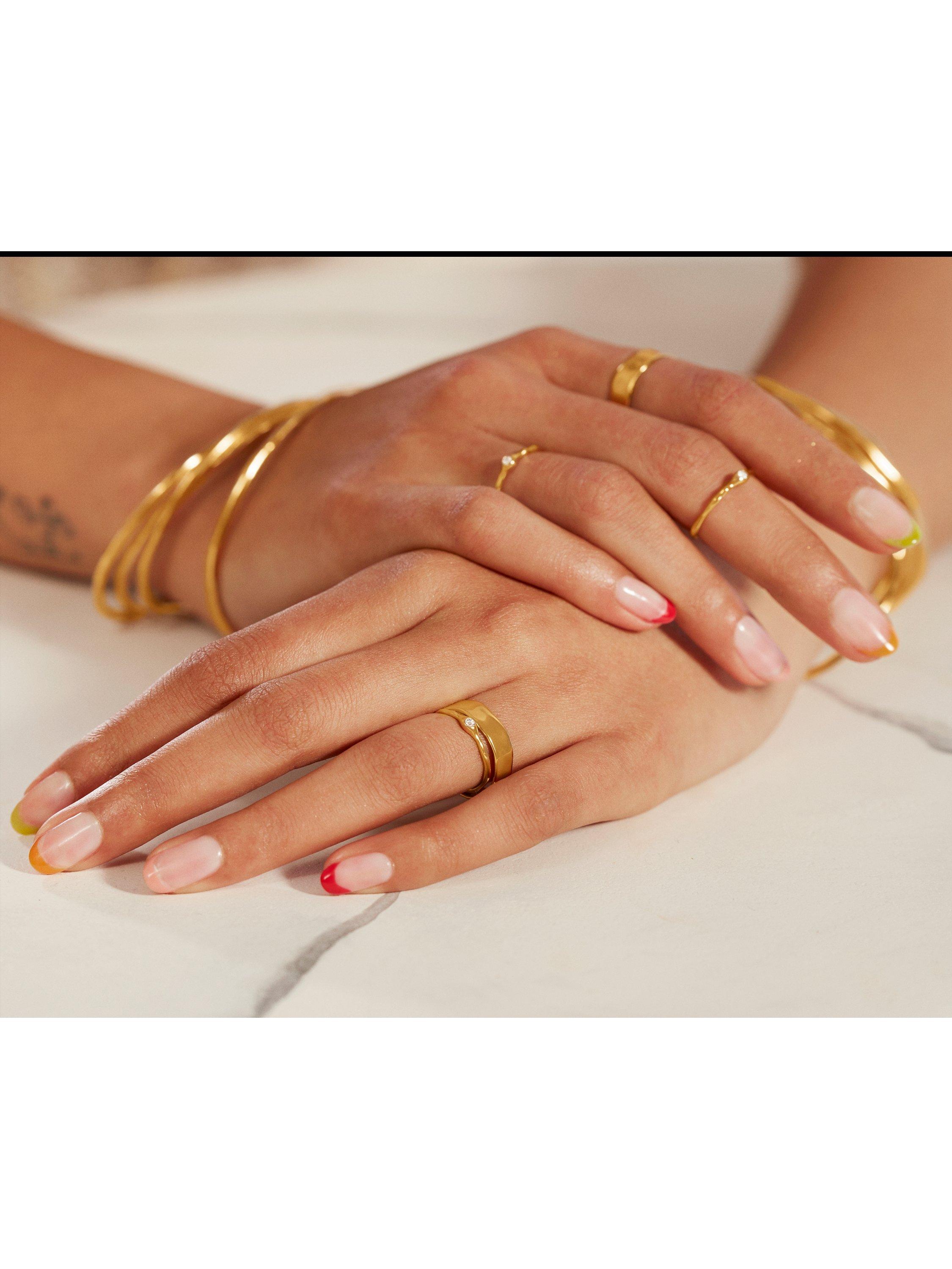 Monica Vinader gold bangle with hammered surface - British product