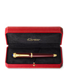 Cartier composite rollerball pen with gold-tone details and blue resin cabochon, 15cm length - British product