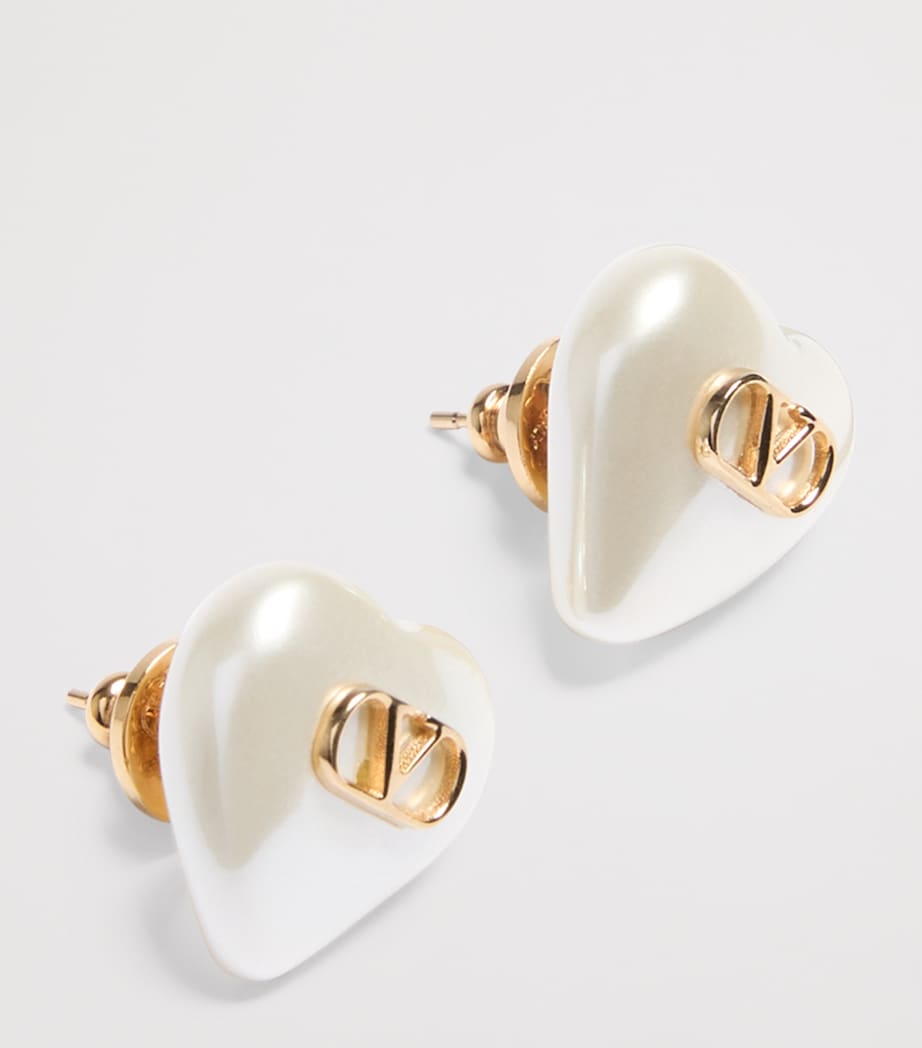 Valentino Garavani VLogo heart earrings in faux pearl and gold tone, imported from the UK
