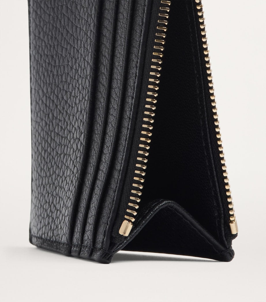Valentino Garavani leather coin and card holder with Rockstud trim (British brand)