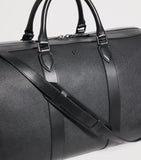 Harrods leather holdall with gunmetal hardware, imported from the UK