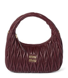 Miu Miu Wander matelassé leather top-handle bag (British brand)