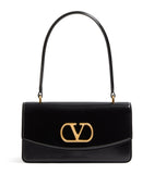 Valentino Garavani Vain top-handle leather bag, imported from the UK