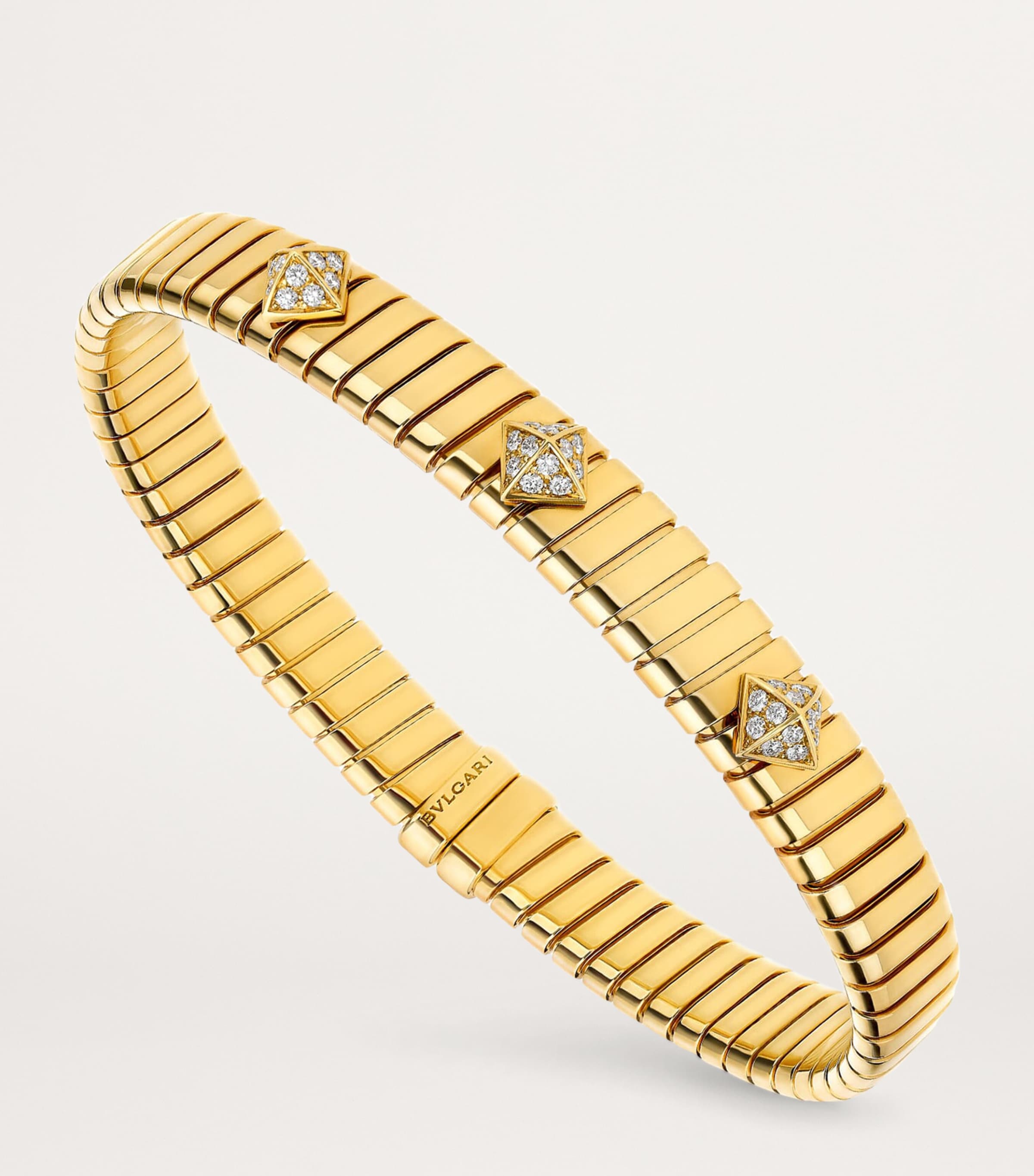 Bvlgari yellow gold Tubogas bangle with diamonds (British brand)