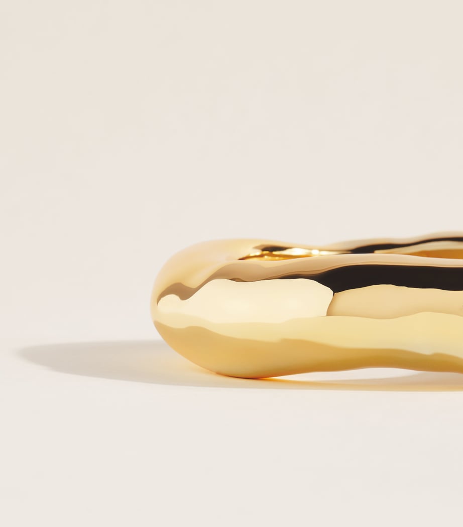 Alexis Bittar gold-plated bangle, UK version